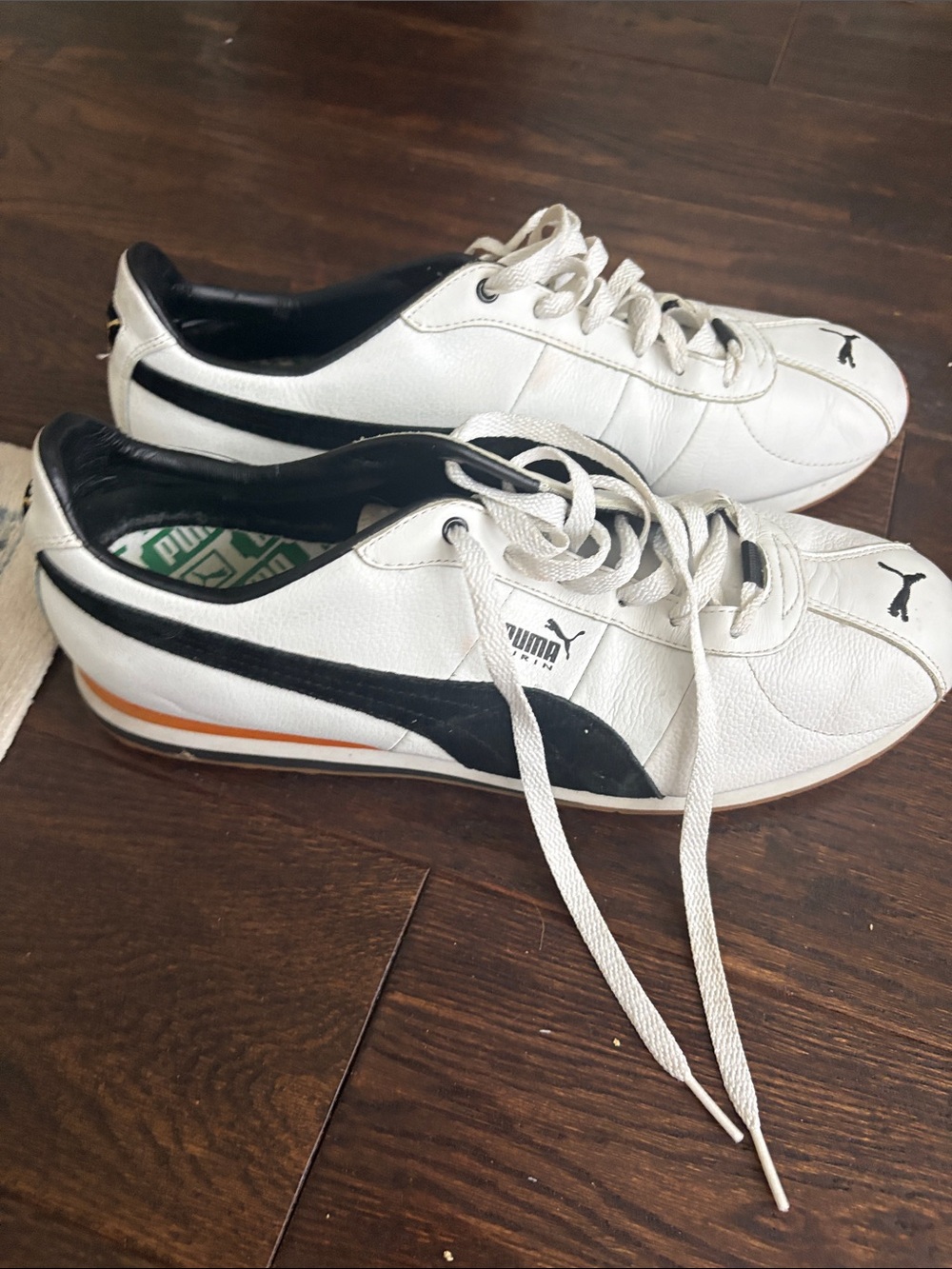 Puma Men’s White Sneakers with Black Stripes and Orange Accent